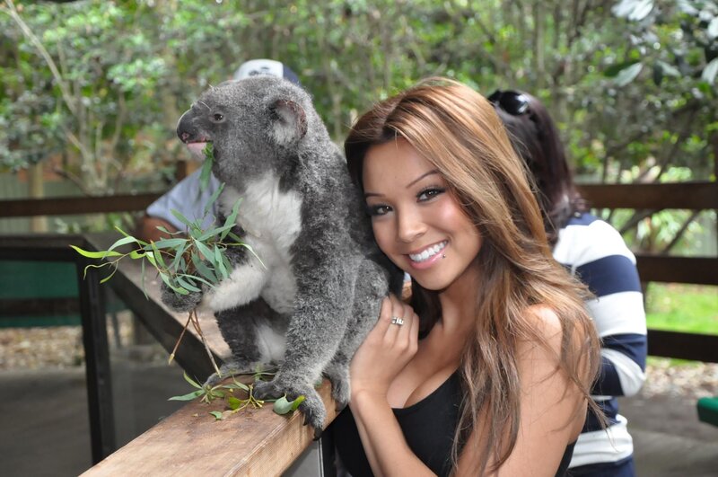 Woman with koala at zoo