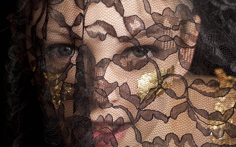 woman with lace veil and gold leaf