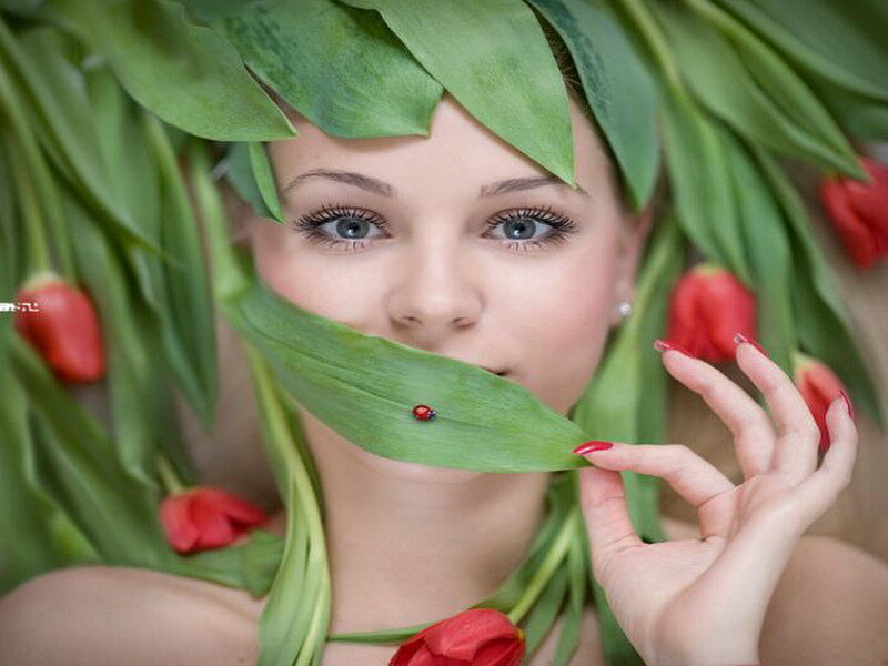 woman with ladybug on leaf