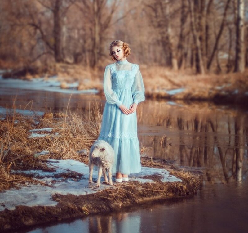 Woman with Lamb by River