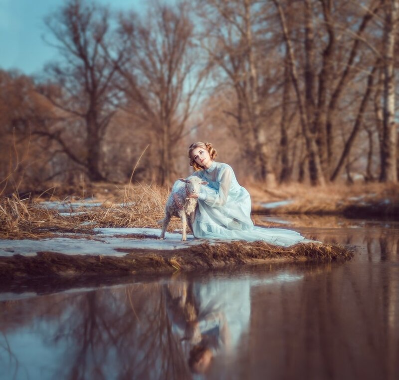 Woman with Lamb in Stream