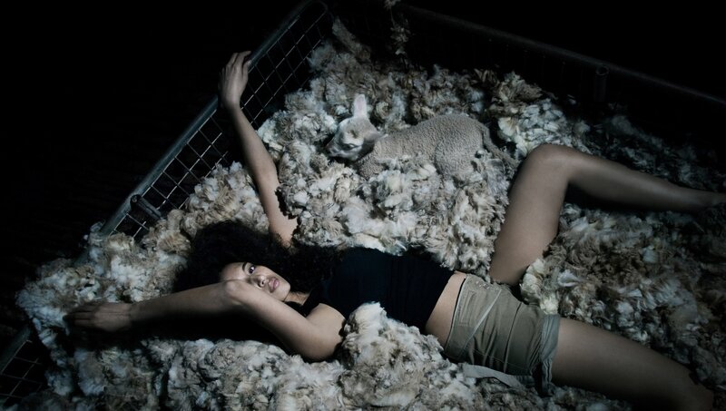 woman with lamb in wool