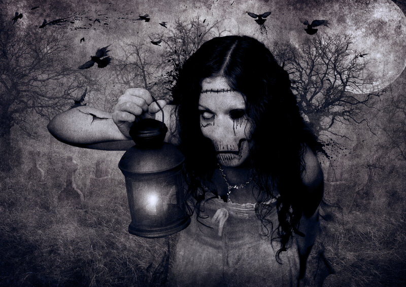 woman with lantern in graveyard