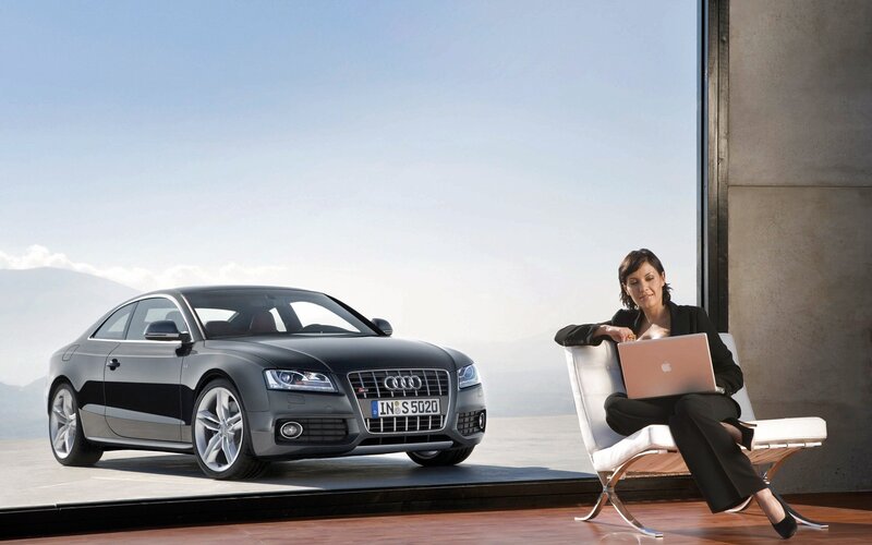 Woman with laptop and Audi car