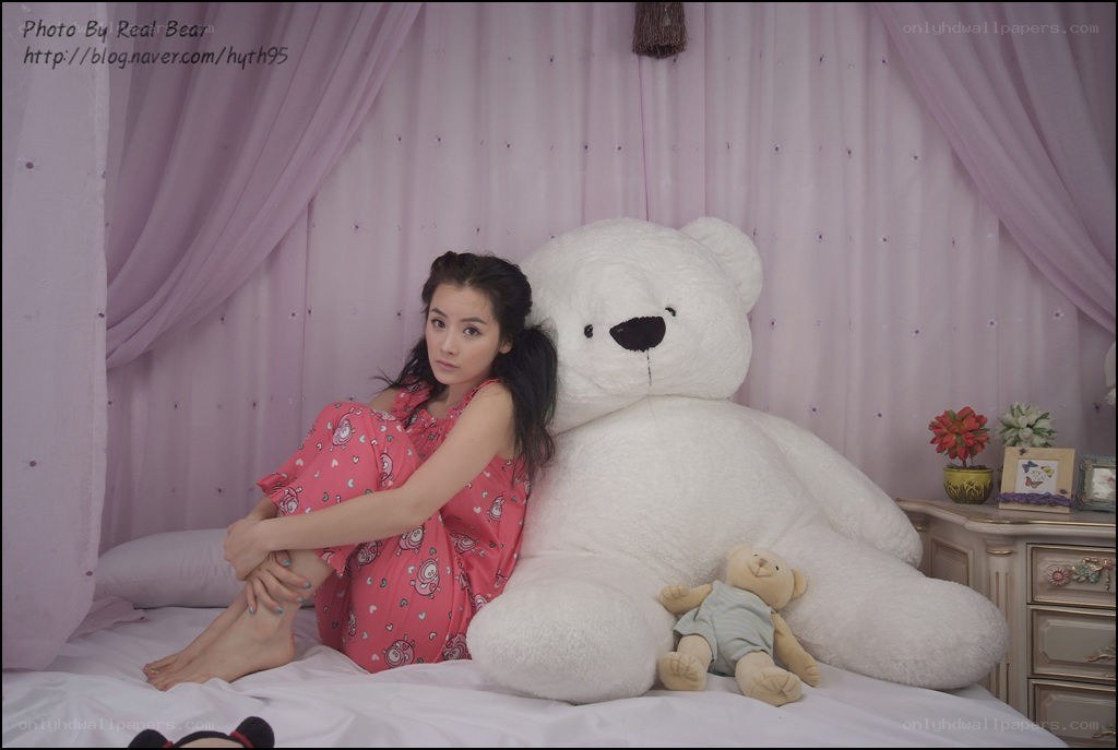 Woman with large teddy bear