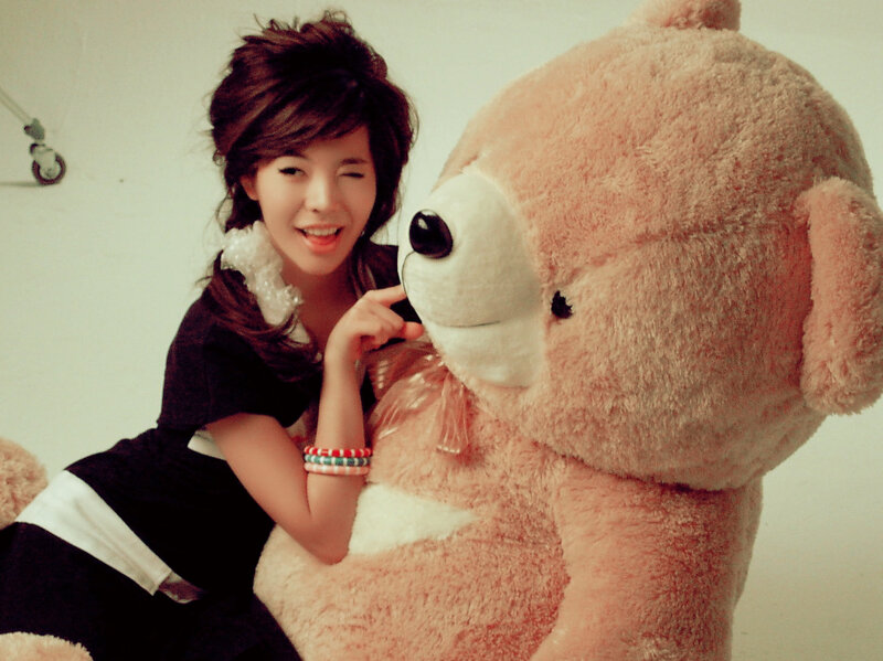 Woman with large teddy bear