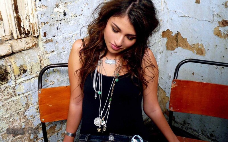 woman with layered necklaces