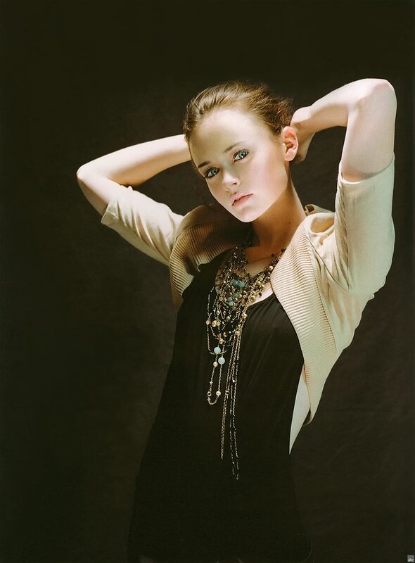woman with layered necklaces