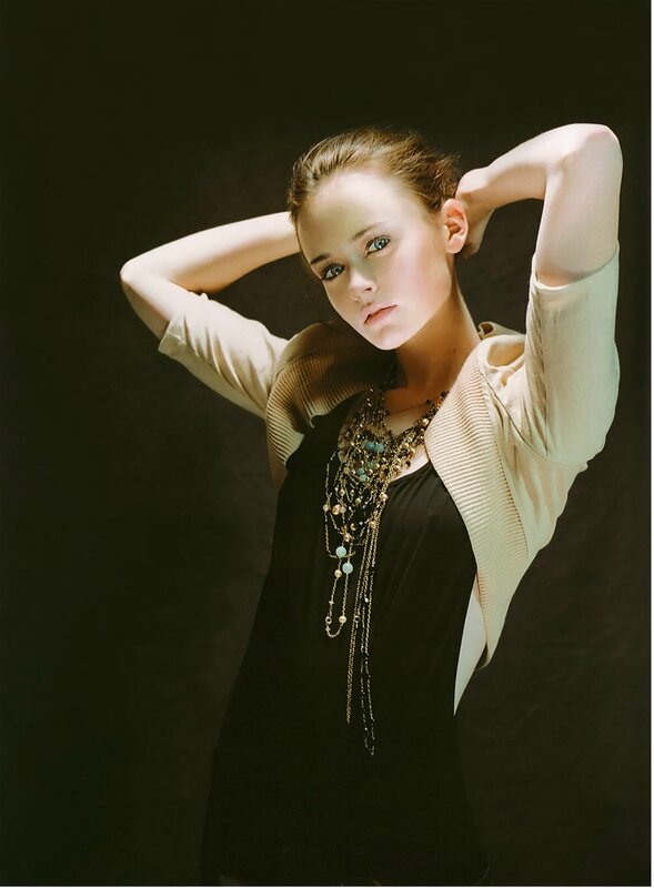woman with layered necklaces