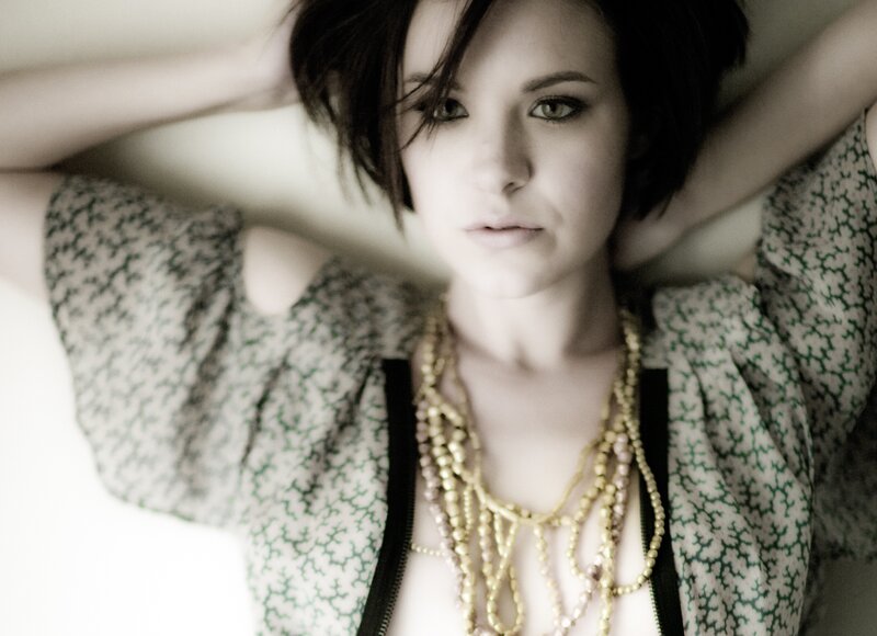 woman with layered necklaces