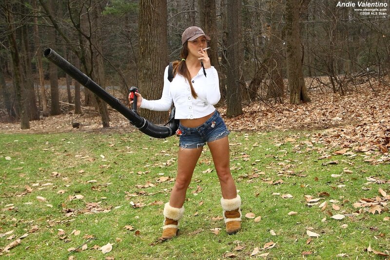 Woman with leaf blower in woods