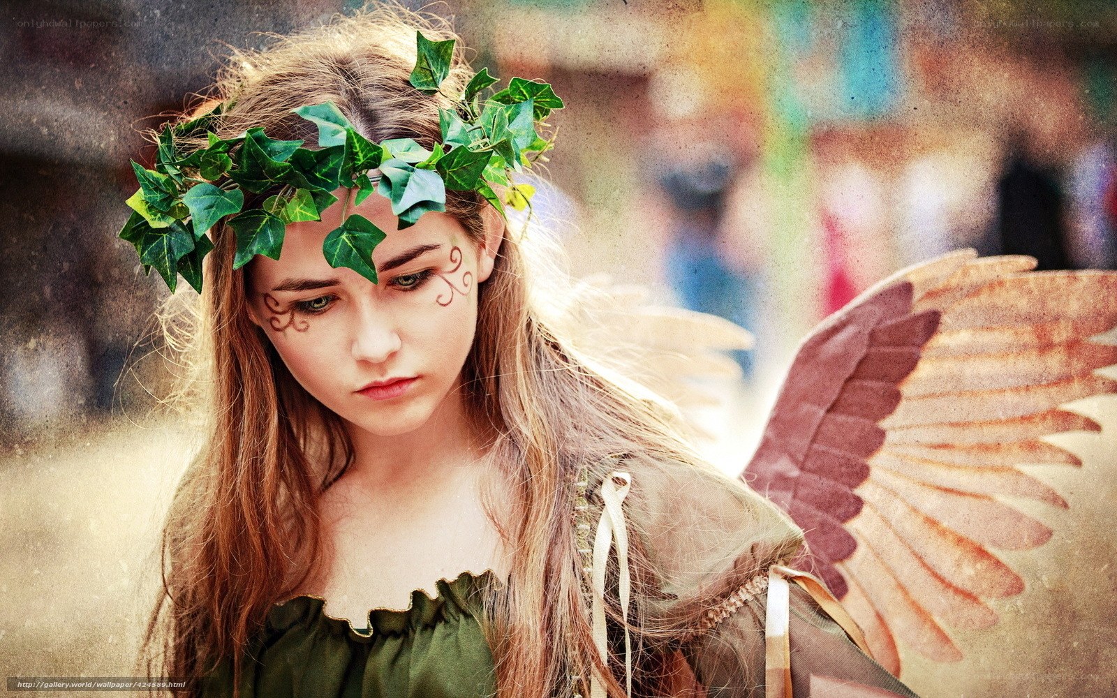 woman with leaf crown and wings