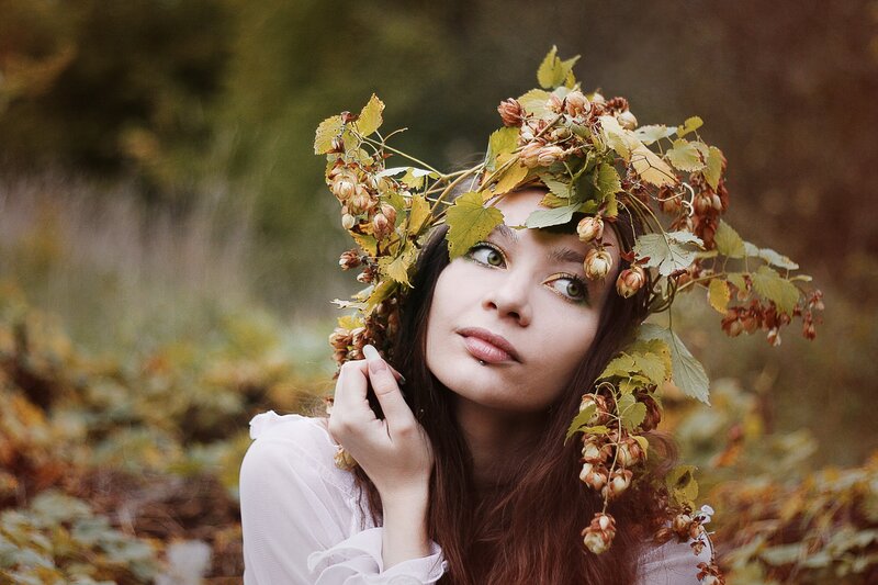 woman with leaf crown in forest