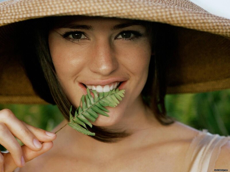 woman with leaf in hat