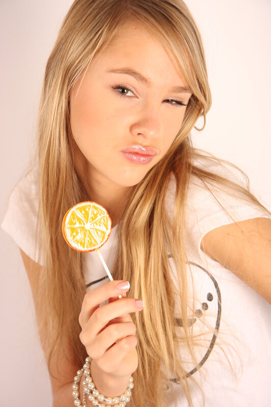Woman with lemon lollipop