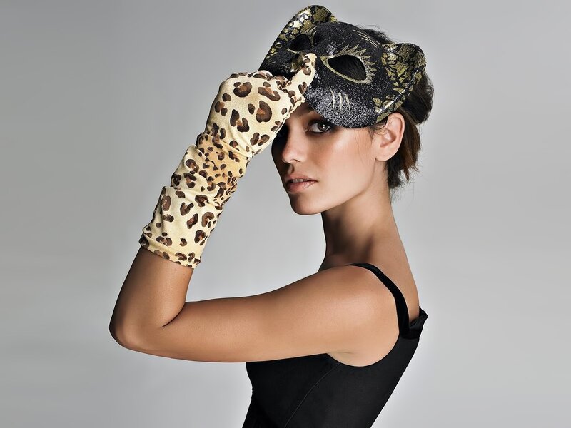 woman with leopard gloves and mask