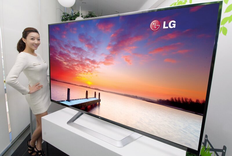 Woman with LG TV display