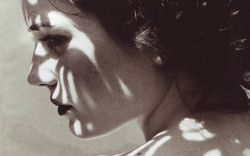 woman with light patterns on face