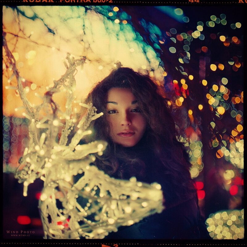 woman with lights in background