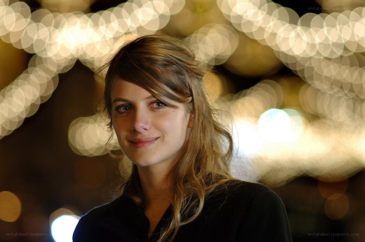 woman with lights in background