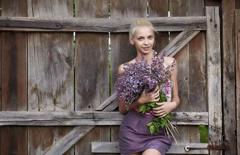 Woman with lilac bouquet