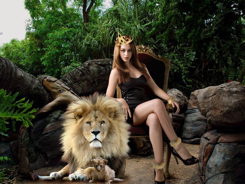 woman with lion in jungle