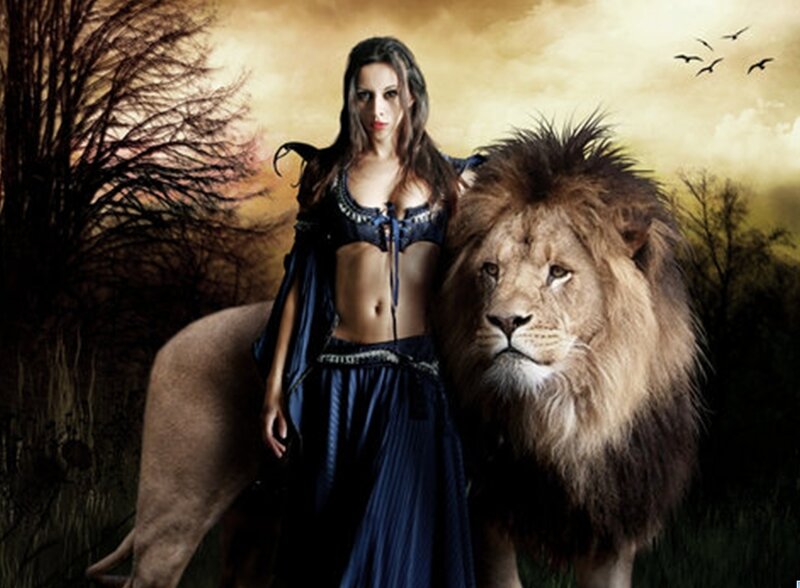 woman with lion in sunset
