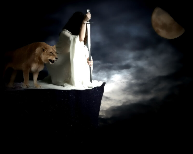 Woman with Lion on Cliff