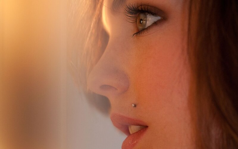 woman with lip piercing in profile