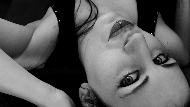 woman with lip piercing lying down