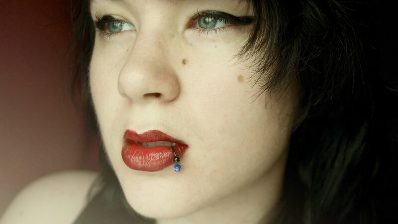 Woman with Lip Piercing — White, Dramatic, Photograph