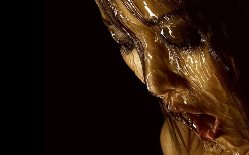woman with liquid covering face