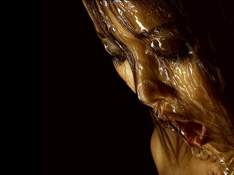 woman with liquid covering face