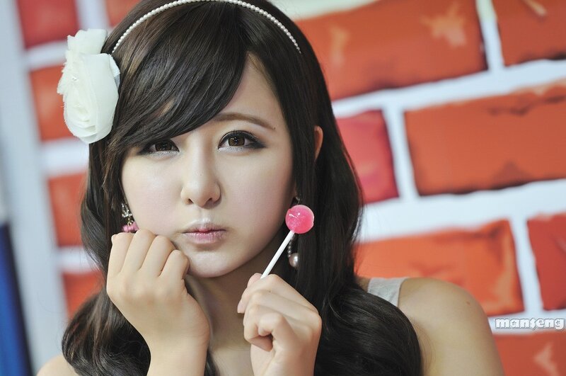 woman with lollipop and flower