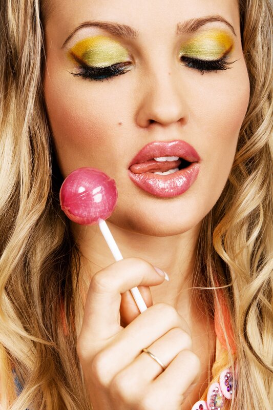 woman with lollipop and makeup