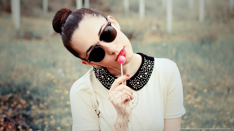 woman with lollipop and sunglasses