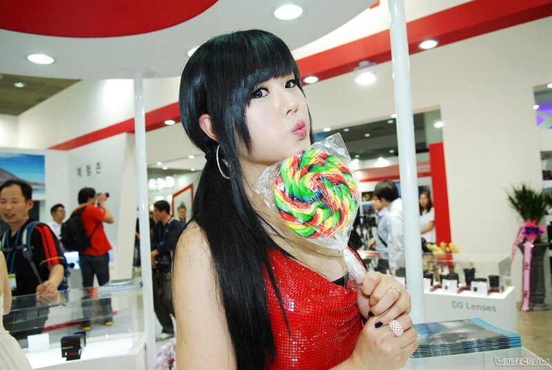 Woman with lollipop at trade show