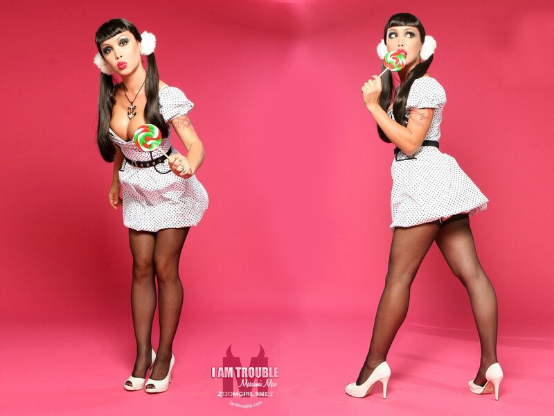 Woman with lollipop in polka-dot dress