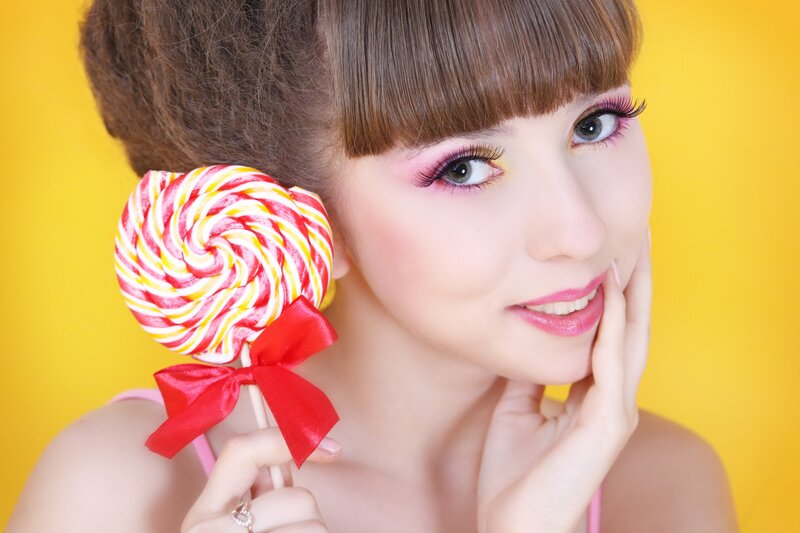 Woman with Lollipop — Yellow, Playful, Photograph
