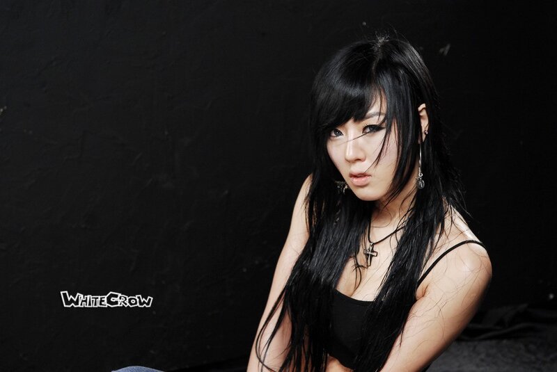 Woman with Long Black Hair — Dramatic, Photograph, Black Top, Necklace, Earrings