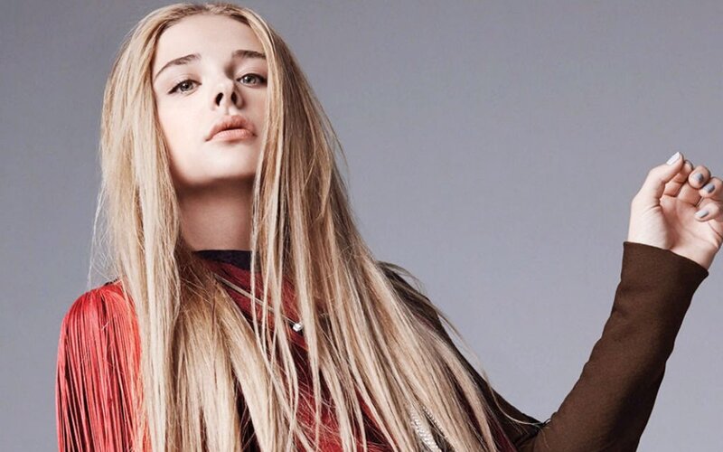 Woman with Long Blonde Hair — Gray, Serious