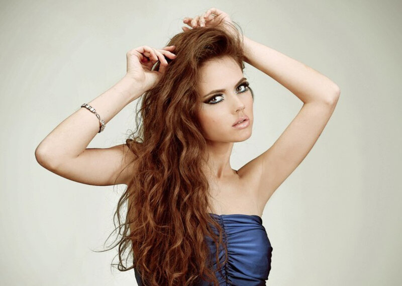 Woman with Long Brown Hair — Blue, Confident, Photograph