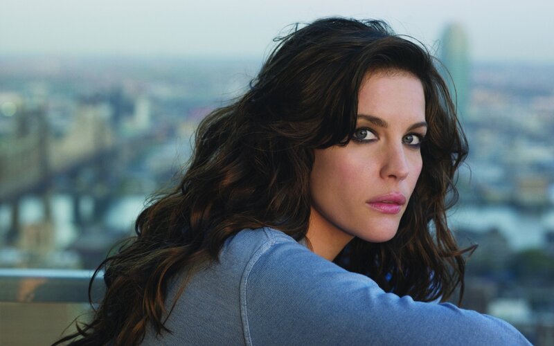 Woman with Long Brown Hair — Blue, Serious, Afternoon