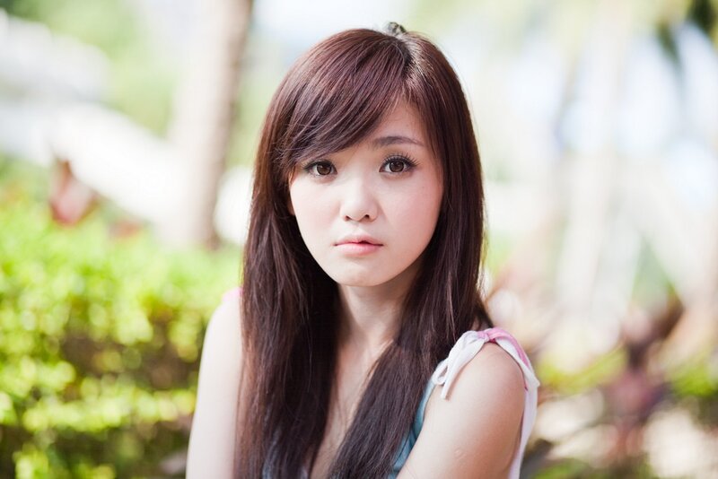 Woman with Long Brown Hair — Calm, Afternoon, Photograph, Green Foliage, Outdoor