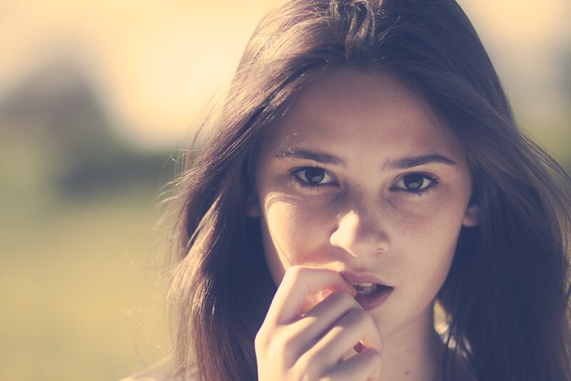 Woman with Long Brown Hair — Contemplative, Sunset