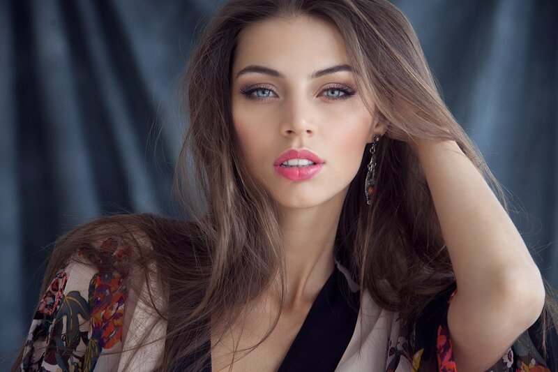 Woman with Long Brown Hair — Dramatic, Photograph, Earring, Makeup, Floral Top
