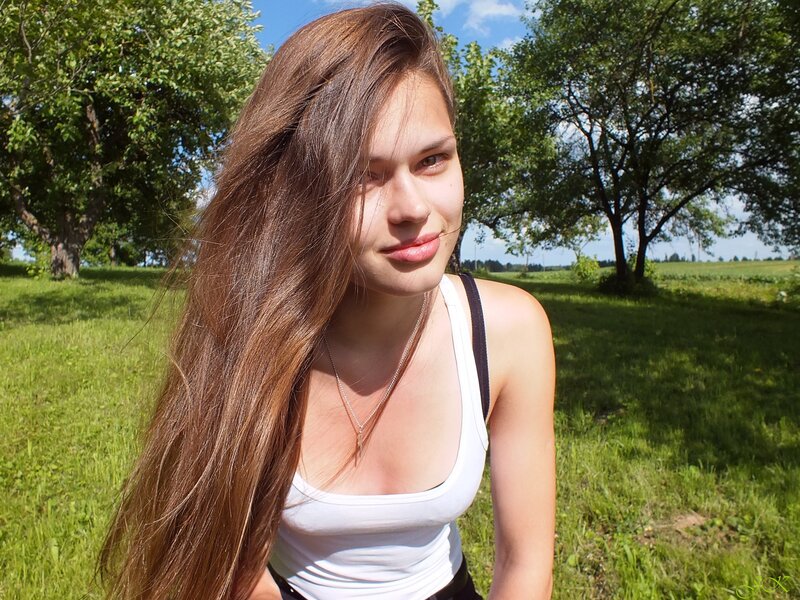 Woman with Long Brown Hair — Green, Serene, Afternoon