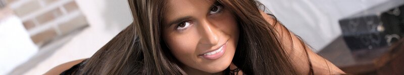 Woman with Long Brown Hair — Neutral, Photograph, Brick Wall, White Surface