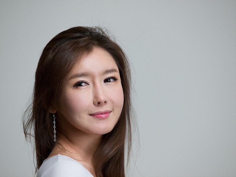 Woman with Long Brown Hair — Neutral, Photograph, Earring, White Top