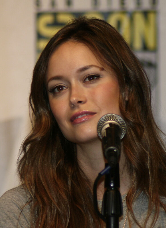 Woman with Long Brown Hair — Neutral, Photograph, Microphone, Grey Shirt
